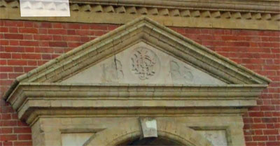 Initials of John Rylands and 1885 on the Longford Institute